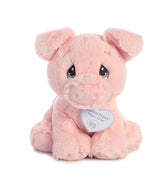 A pink pig plush toy from Precious Moments by Aurora with soft fur and a round snout.